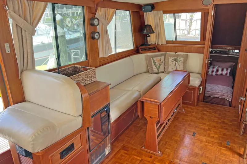 Slide: The Image of Interior of a 1991 Grand Banks 42 Motoryacht with elegant wood and leather furnishings. - 4