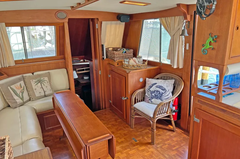Slide: The Image of Interior of 1991 Grand Banks 42 Motoryacht with wooden decor and cozy seating area. - 5