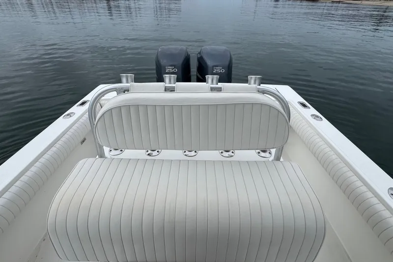 Slide: The Image of 2007 Regulator 26 Forward Seating boat with twin Yamaha 250 engines on calm water. - 8