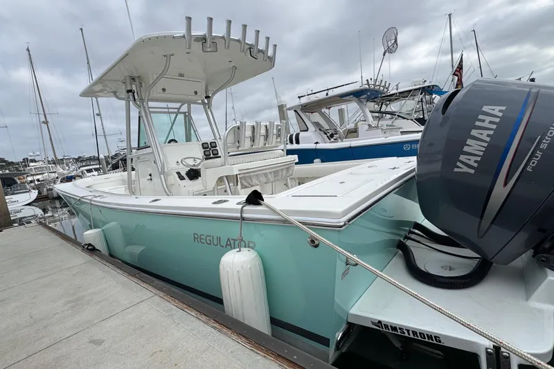 Slide: The Image of 2007 Regulator 26 Forward Seating boat docked with Yamaha engine. - 2