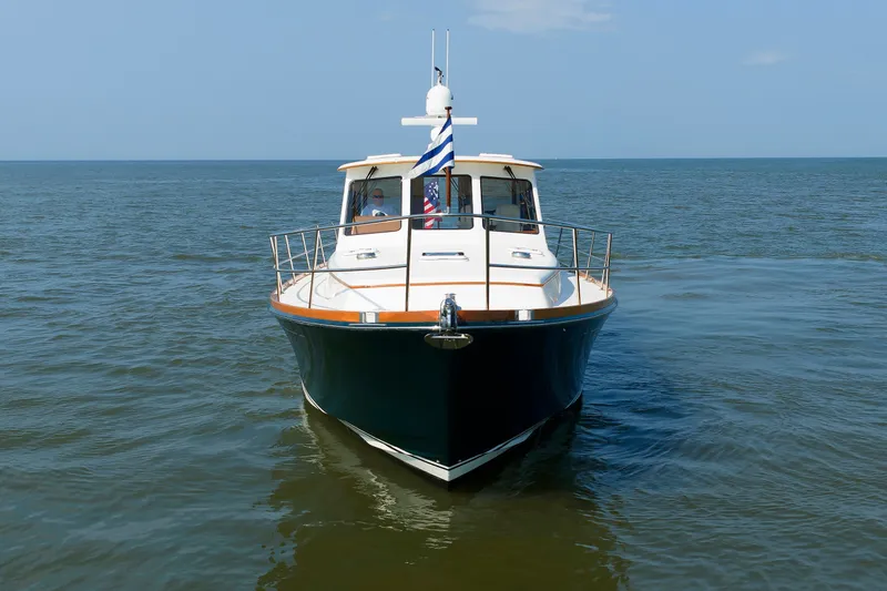 Slide: The Image of Alden 52 Salon Express 2008 yacht cruising on open water under clear skies. - 53