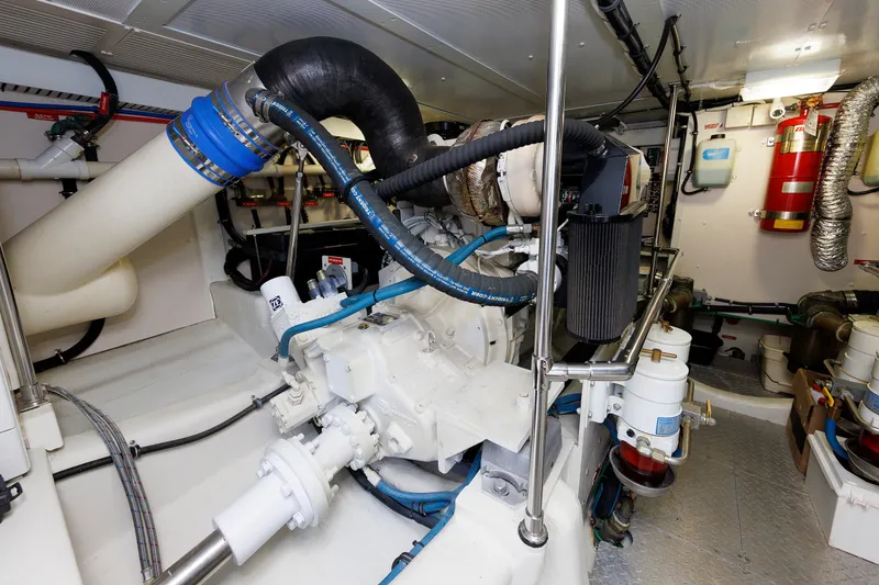 Slide: The Image of Engine room of 2008 Alden 52 Salon Express yacht, showcasing mechanical components and systems. - 49