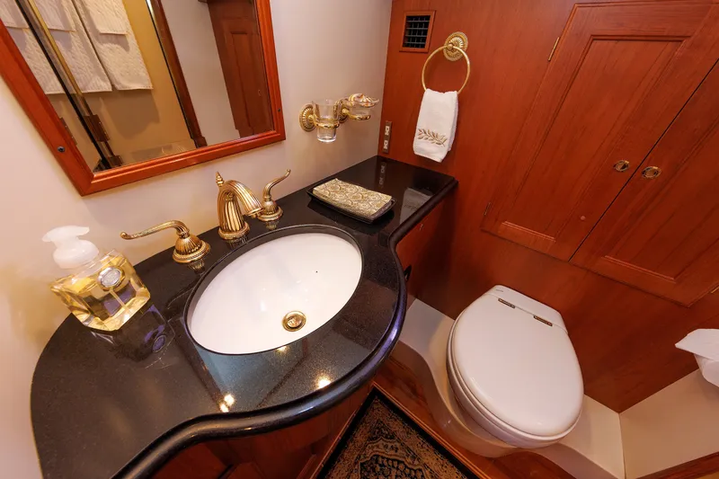Slide: The Image of Luxurious bathroom in 2008 Alden 52 Salon Express yacht with elegant fixtures and wood cabinetry. - 35