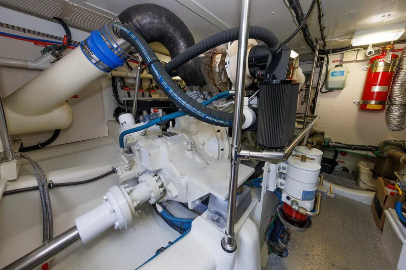 Slide: The Image of Engine room of 2008 Alden 52 Salon Express yacht, featuring complex machinery and piping. - 50