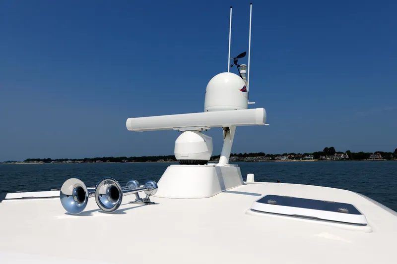 Slide: The Image of Alden 52 Salon Express 2008 yacht with radar and horns on deck, cruising on calm waters. - 46