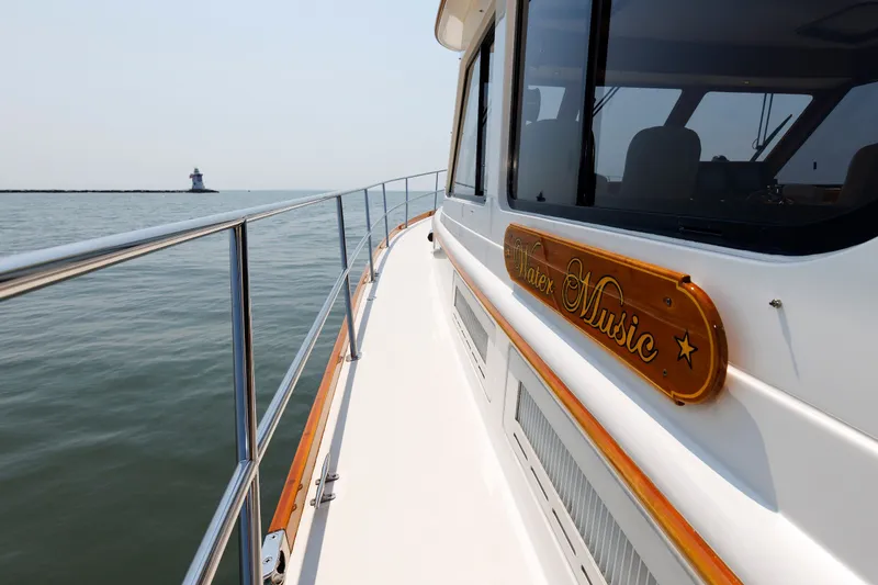 Slide: The Image of Alden 52 Salon Express yacht cruising near a lighthouse, 2008 model. - 43