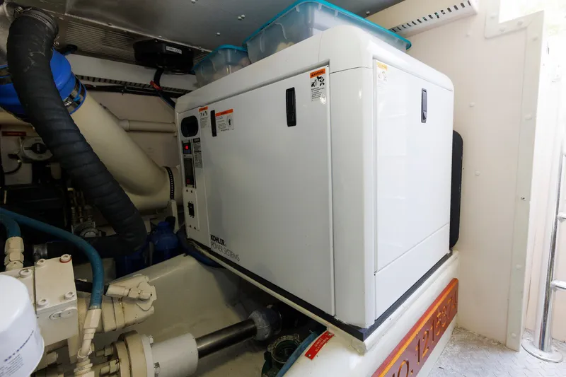 Slide: The Image of Engine room of 2008 Alden 52 Salon Express with Kohler power system. - 52