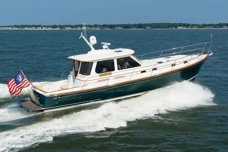 The Image of Alden 52 Salon Express 2008 cruising on open water with American flag. - 0