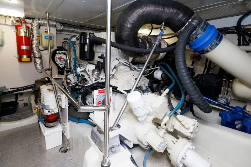 Slide: The Image of Engine room of 2008 Alden 52 Salon Express with visible machinery and piping. - 48