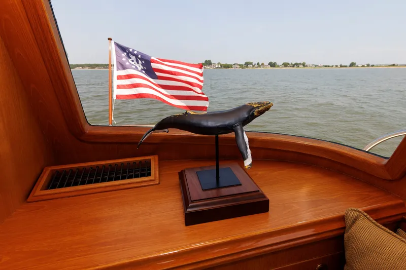 Slide: The Image of Alden 52 Salon Express 2008 interior with whale sculpture and American flag view. - 17