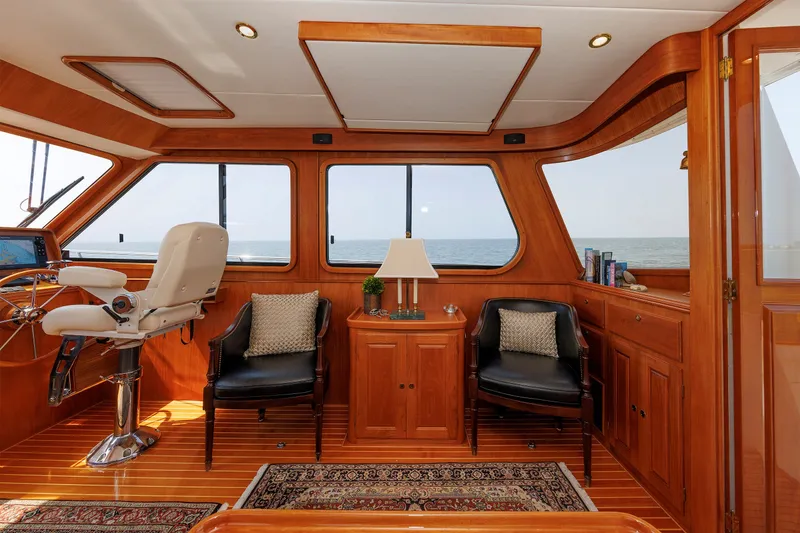 Slide: The Image of Luxurious interior of 2008 Alden 52 Salon Express yacht with elegant wood finish and ocean view. - 13