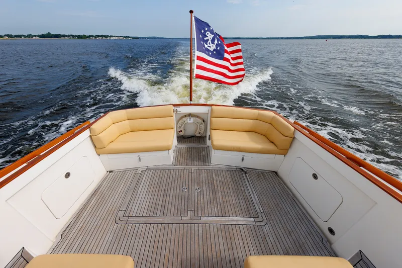 Slide: The Image of Alden 52 Salon Express 2008 yacht with flag, cruising on open water. - 39