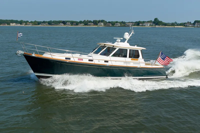 Slide: The Image of Alden 52 Salon Express 2008 cruising on open water with American flag. - 58