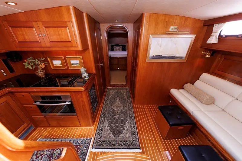 Slide: The Image of Luxurious interior of 2008 Alden 52 Salon Express yacht with elegant wood finish. - 24
