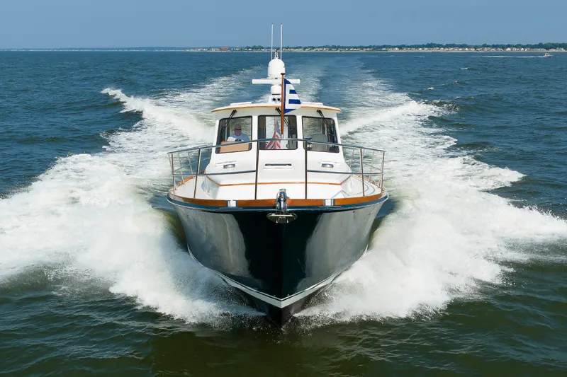 Slide: The Image of Alden 52 Salon Express 2008 cruising on open water, showcasing sleek design and performance. - 59