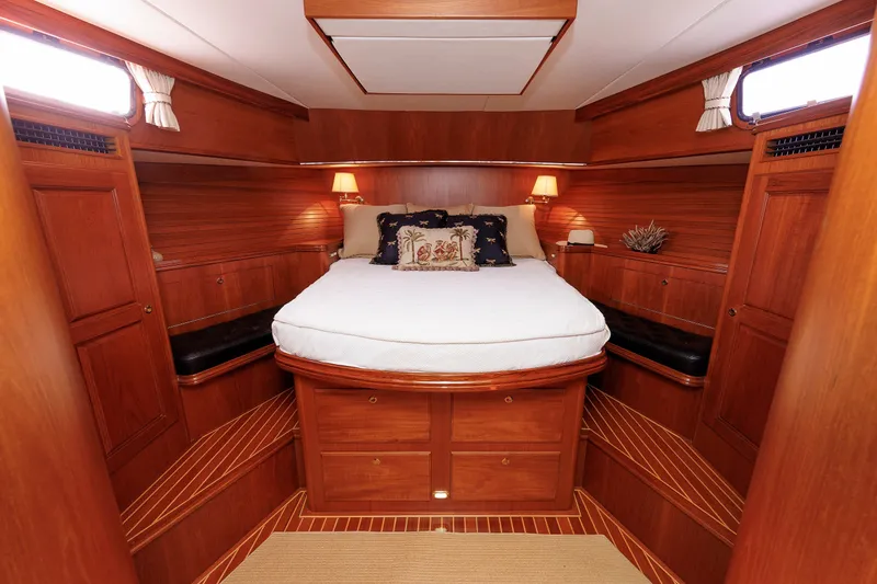 Slide: The Image of Luxurious 2008 Alden 52 Salon Express yacht cabin with elegant wood interior and cozy bedding. - 28