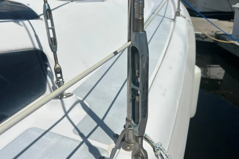 Slide: The Image of Close-up of rigging on a 1999 Hunter 380 sailboat, showing detailed hardware. - 10