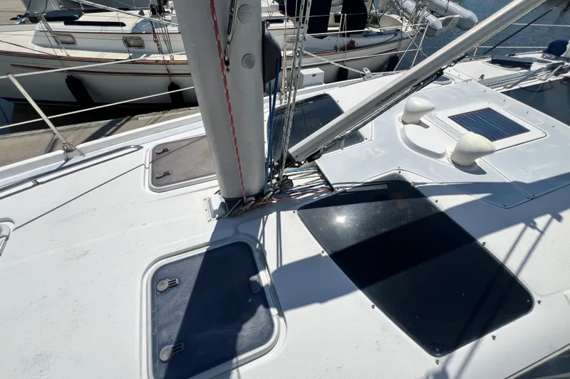 Slide: The Image of Deck view of a 1999 Hunter 380 sailboat with rigging and hatches. - 17