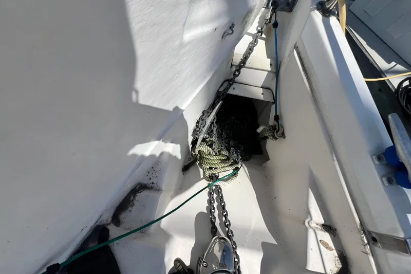 Slide: The Image of Anchor chain and ropes on a 1999 Hunter 380 sailboat deck. - 18