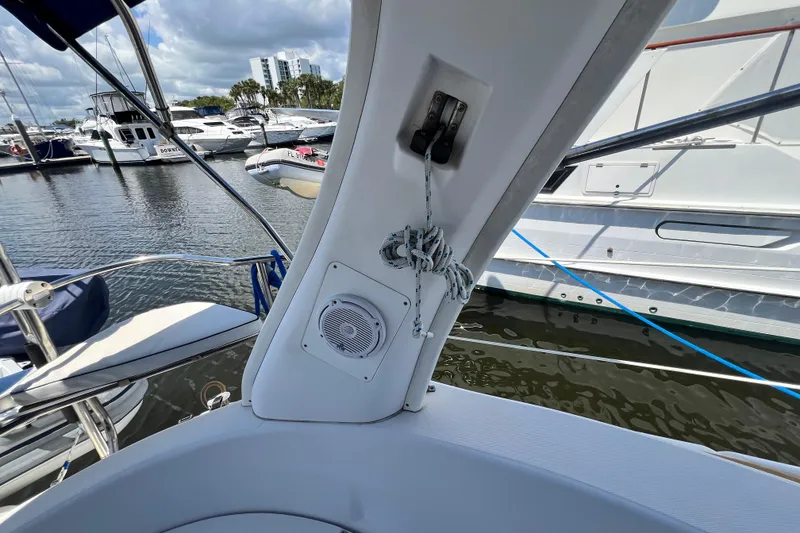 Slide: The Image of Hunter 380 sailboat interior, 1999 model, docked at marina with visible speaker and ropes. - 29