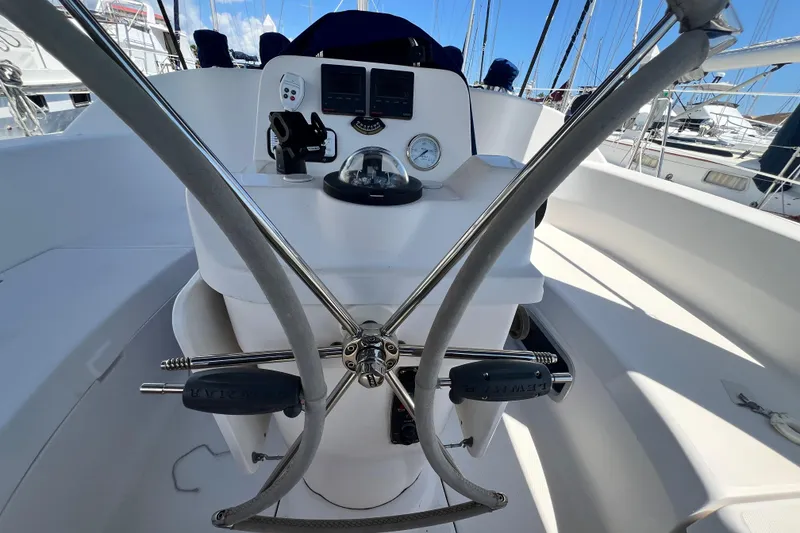 Slide: The Image of Cockpit of a 1999 Hunter 380 sailboat with steering wheel and navigation instruments. - 39