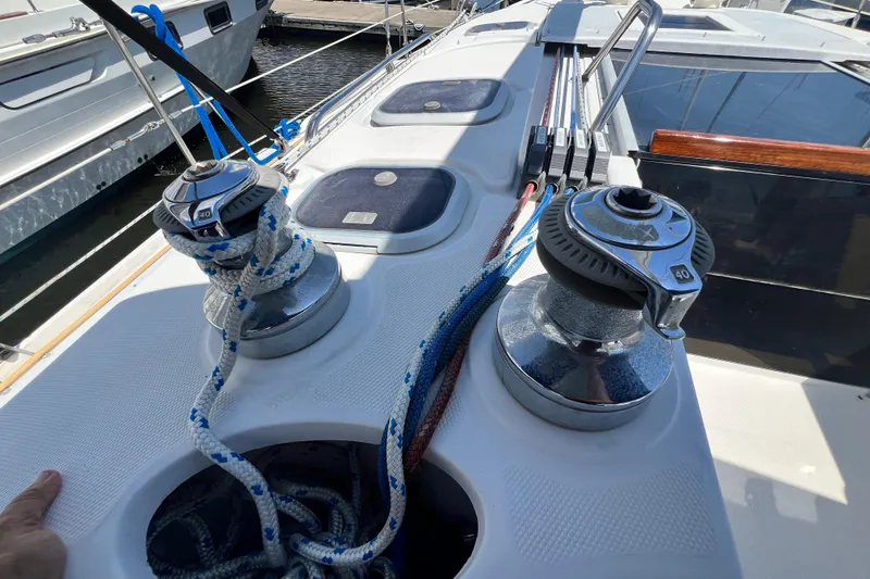 Slide: The Image of Deck of 1999 Hunter 380 sailboat with winches and ropes in marina. - 41