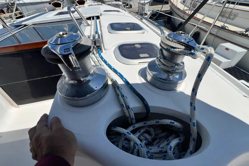 Slide: The Image of Sailboat deck with winches and ropes on a 1999 Hunter 380 model. - 43
