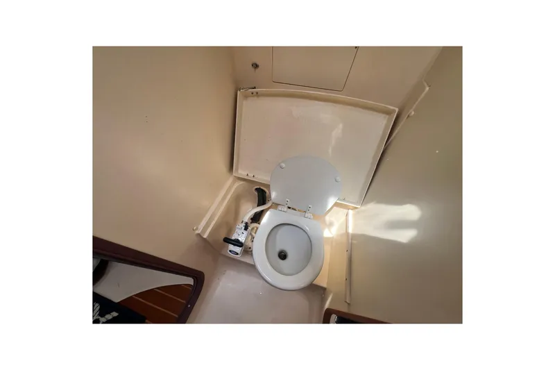 Slide: The Image of 1999 Hunter 380 yacht bathroom with compact marine toilet. - 69