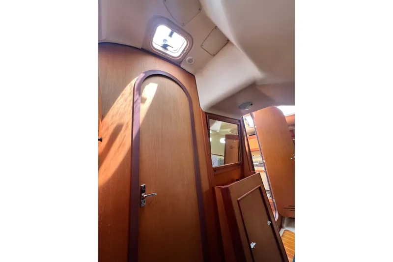 Slide: The Image of Interior of 1999 Hunter 380 sailboat with wooden doors and ceiling hatch. - 72