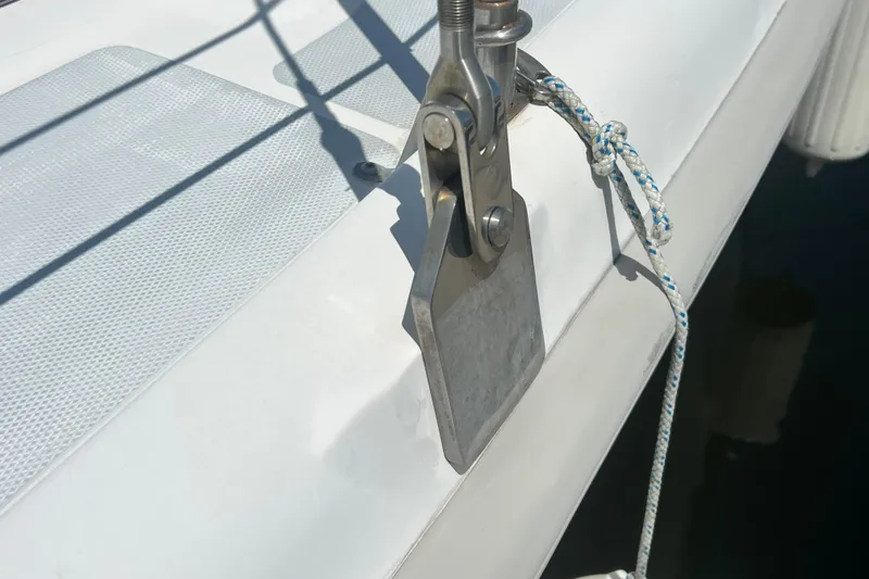 Slide: The Image of Close-up of a 1999 Hunter 380 sailboat deck with rigging hardware and rope. - 9