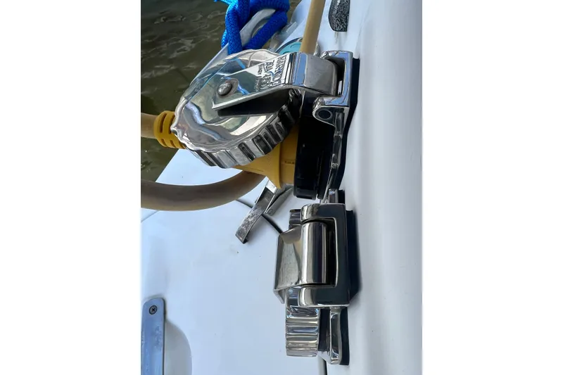 Slide: The Image of Close-up of a 1999 Hunter 380 yacht's deck hardware with blue rope and chrome fittings. - 93