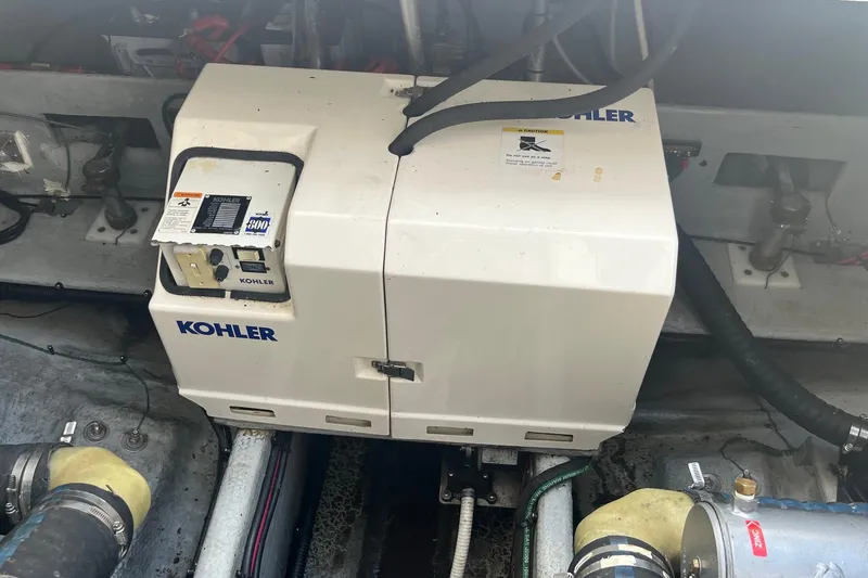 Slide: The Image of Engine room of a 1996 Mainship 40 Sedan Bridge with Kohler generator. - 11