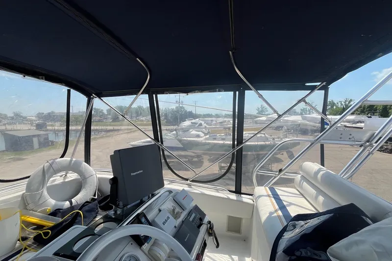 Slide: The Image of Interior view of 1996 Mainship 40 Sedan Bridge yacht cockpit with navigation equipment. - 23