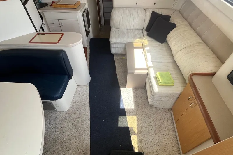 Slide: The Image of Interior of 1996 Mainship 40 Sedan Bridge with seating, kitchenette, and storage. - 28