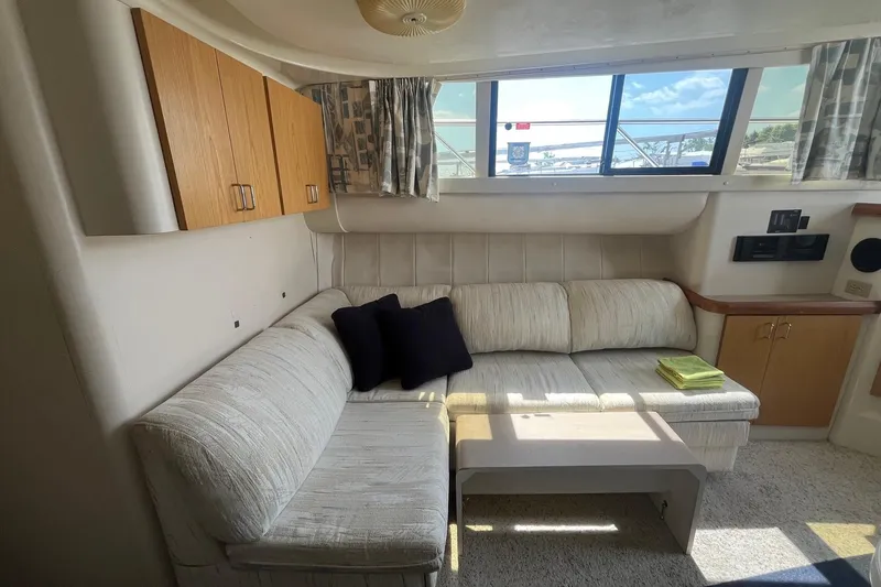 Slide: The Image of Interior of 1996 Mainship 40 Sedan Bridge with cozy seating and natural light. - 32
