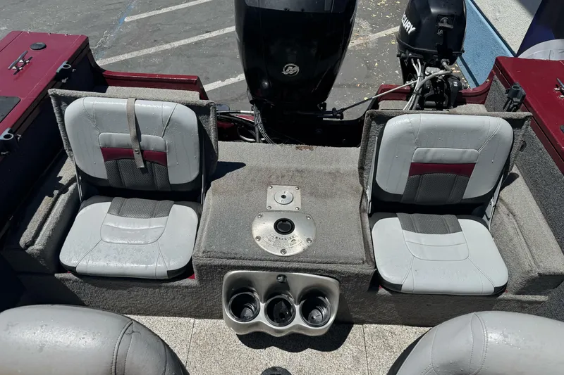 Slide: The Image of 2012 Tracker Targa V-18 Combo boat interior with dual seats and motor. - 22
