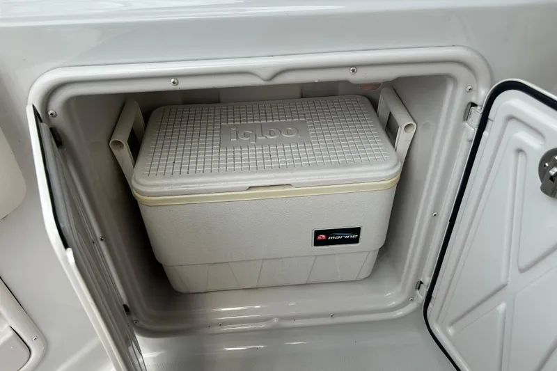 Slide: The Image of Cooler stored in a compartment of a 2006 Crownline 270 CR boat. - 13