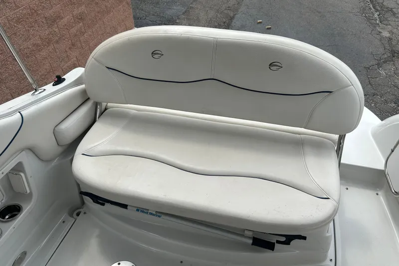 Slide: The Image of White seating area on a 2006 Crownline 270 CR boat, featuring cushioned seats. - 15