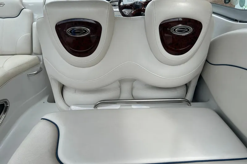Slide: The Image of Interior seating of a 2006 Crownline 270 CR boat, featuring white leather upholstery. - 18