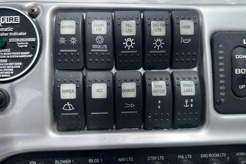 Slide: The Image of Control panel of a 2006 Crownline 270 CR boat with labeled switches. - 22