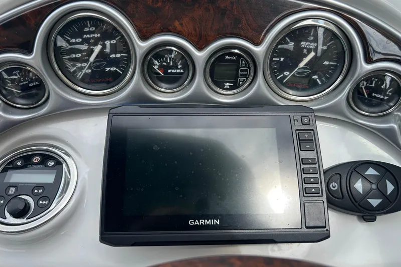 Slide: The Image of Dashboard of a 2006 Crownline 270 CR boat with Garmin navigation system. - 24