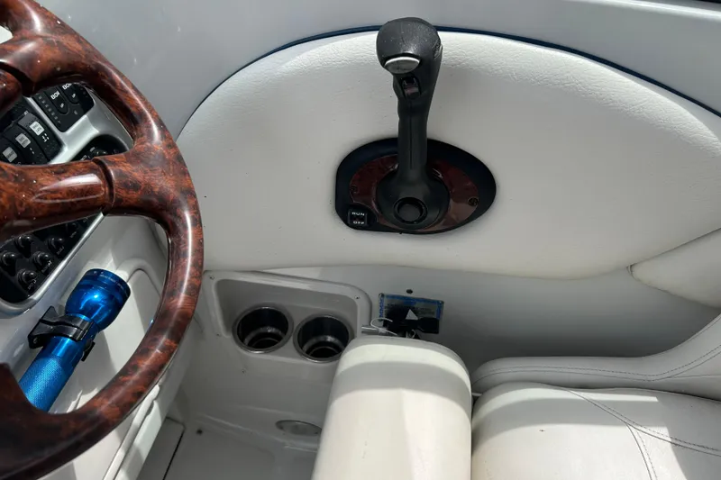 Slide: The Image of Interior of 2006 Crownline 270 CR boat showing steering wheel and controls. - 26