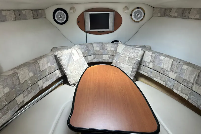 Slide: The Image of Interior of 2006 Crownline 270 CR boat with cozy seating and TV. - 28