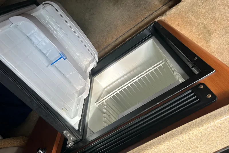 Slide: The Image of Open refrigerator inside 2006 Crownline 270 CR boat cabin. - 35