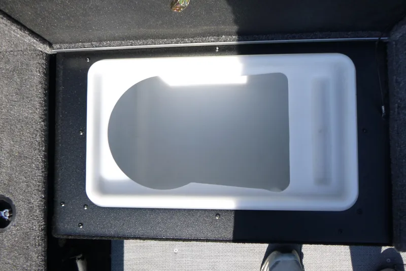 Slide: The Image of 2024 Alumacraft Competitor 185X Sport livewell compartment, interior view. - 15