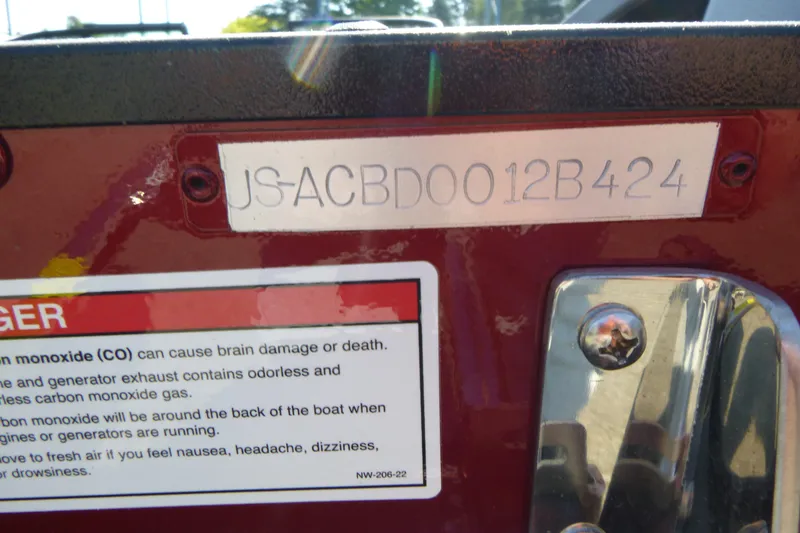 Slide: The Image of 2024 Alumacraft Competitor 185X Sport boat identification number and safety warning label. - 19
