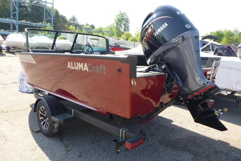 Slide: The Image of 2024 Alumacraft Competitor 185X Sport boat with Yamaha outboard motor on trailer. - 3