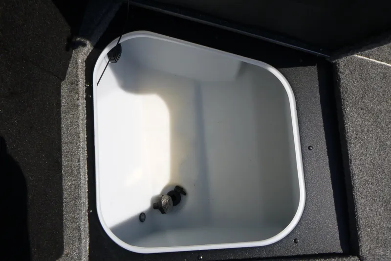 Slide: The Image of 2024 Alumacraft Competitor 185X Sport livewell interior with drain and aerator. - 9