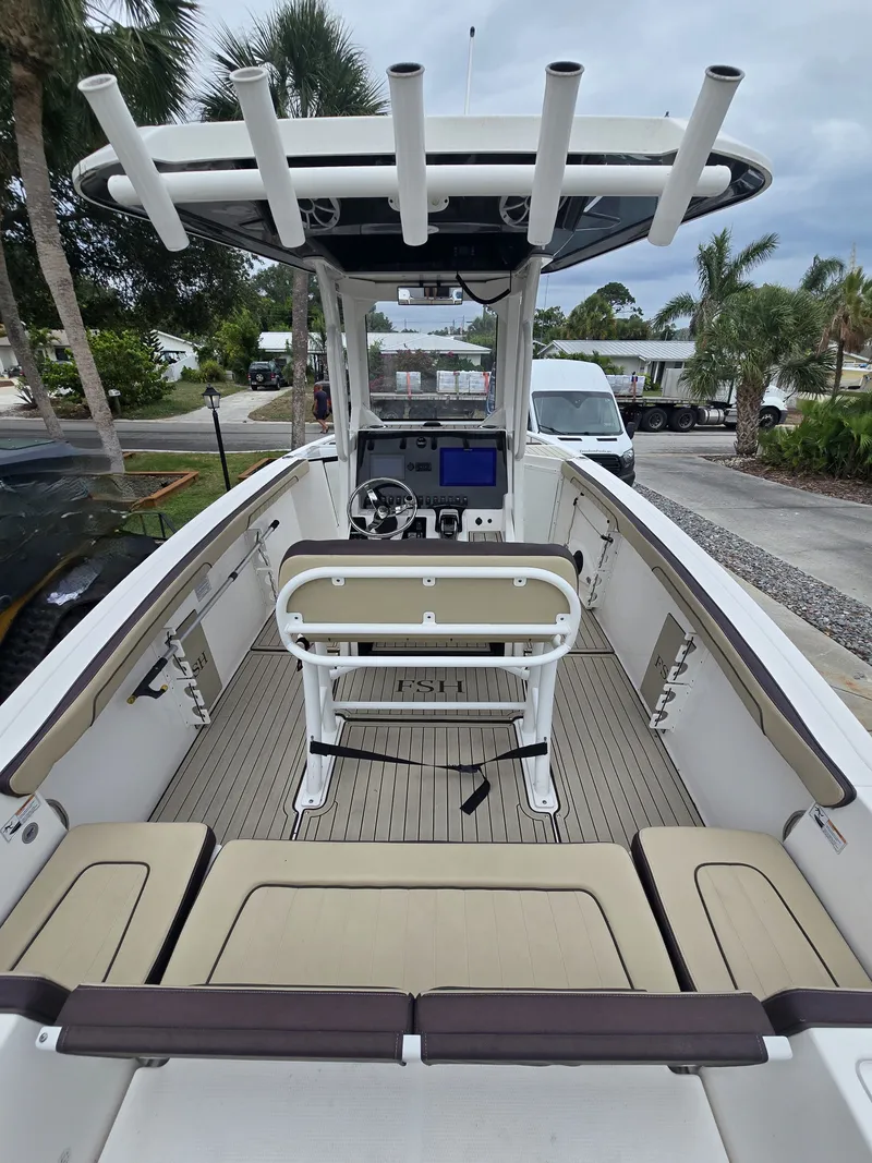 Slide: The Image of Interior of a 2022 Yamaha 255 FSH Sport E boat with seating. - 5