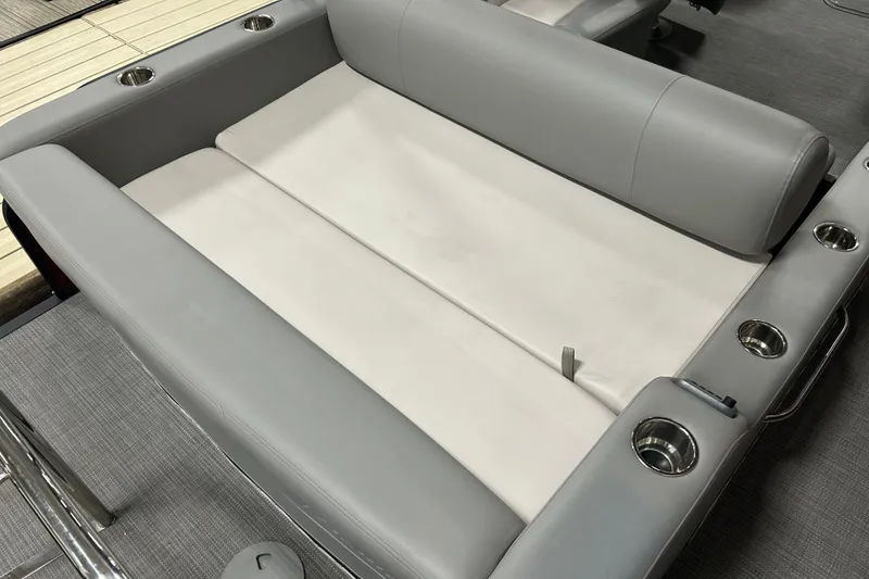 Slide: The Image of Gray seating area on 2022 Manitou 25 Encore boat with cup holders. - 17